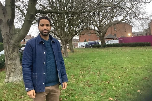 Sean Fletcher stands on Friars Place Green