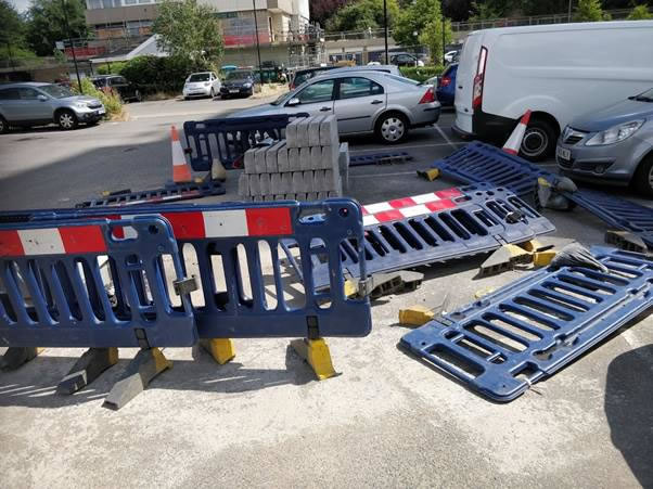 A car parked in a parking lot Description automatically generated