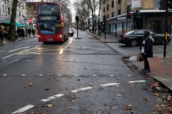 A picture containing outdoor, bus, way, scene Description automatically generated