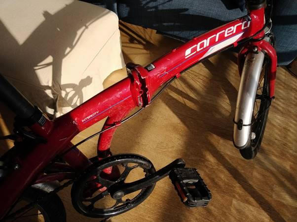 A picture containing bicycle, motorcycle, sitting, parked Description automatically generated