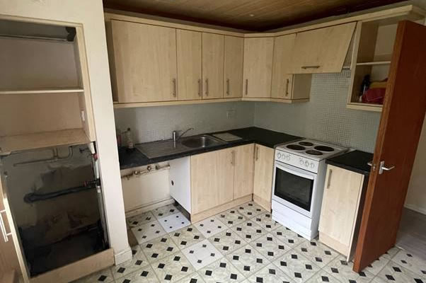 A kitchen with a tile floor