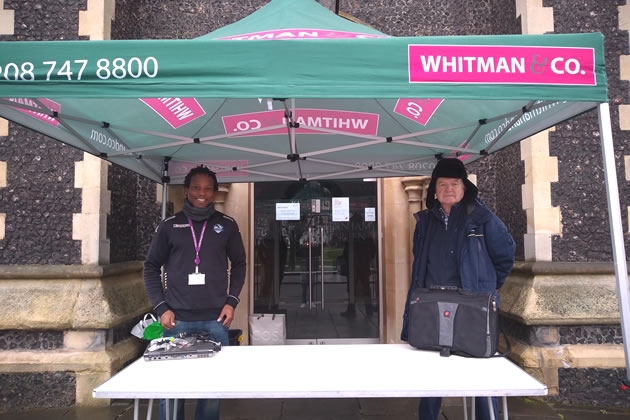 Cllr Ron Mushiso (left) at the laptop drive in Chiswick