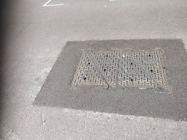 A picture containing road, outdoor, building, street Description automatically generated