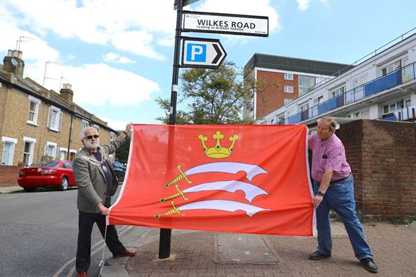 A picture containing outdoor, building, person, holding  Description automatically generated