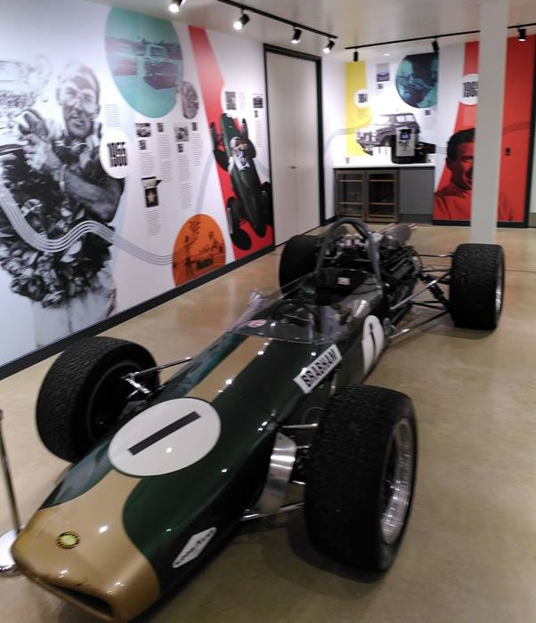 A race car in a room Description automatically generated with medium confidence