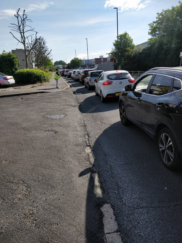 A car parked on the side of a road  Description automatically generated