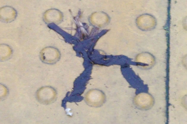 small flat person whose head appears to have exploded