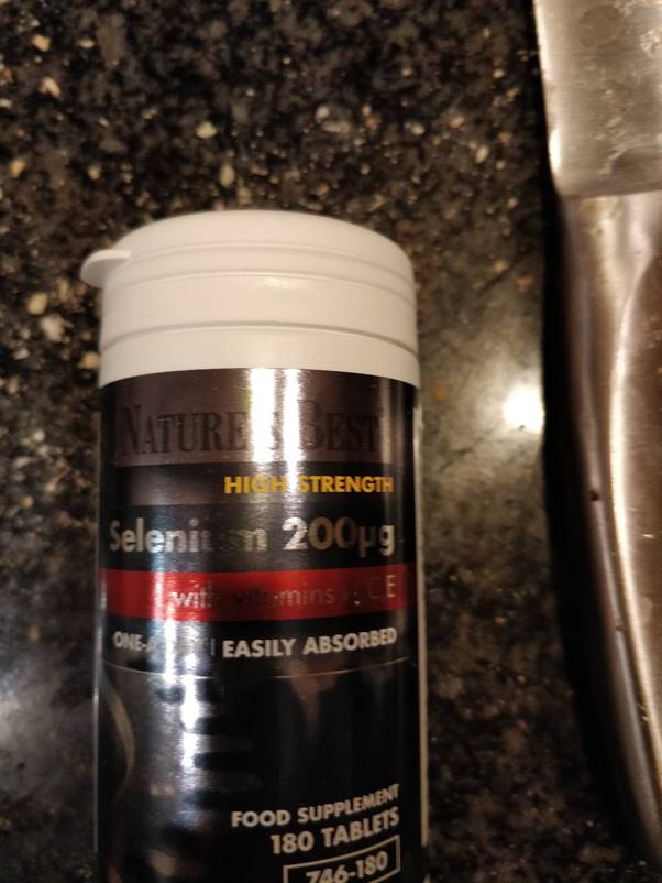A bottle of liquid Description automatically generated with low confidence