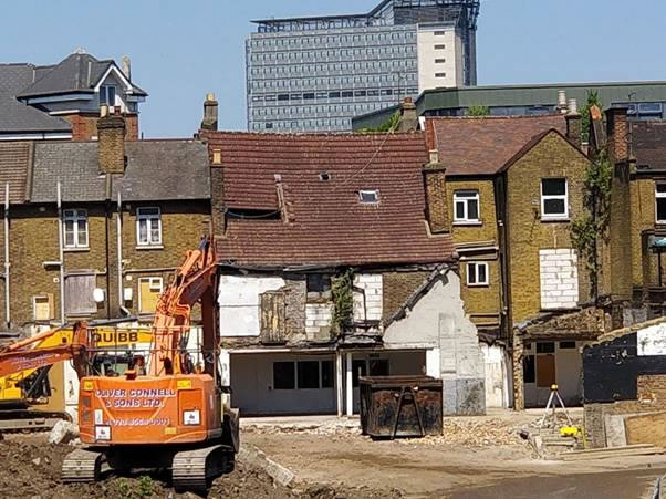 A truck is parked in front of a building Description automatically generated