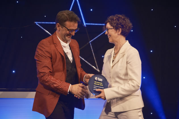 Tommy Robinson accepts the award on behalf of his department at Chiswick School