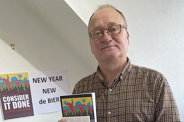 Gavin de Bier with a copy of his book