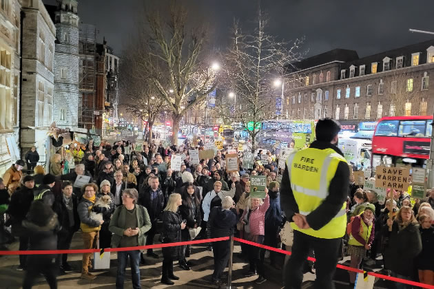 Protestors assemble while the meeting was taking place