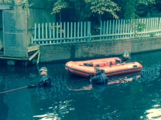 Police divers search canal
