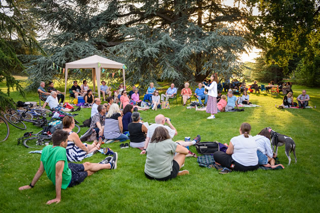 Samaritans volunteers listen to Marie Naffah at their summer party